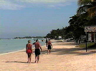 Bev and Dave on the Charela Inn beach in Negril Jamaica