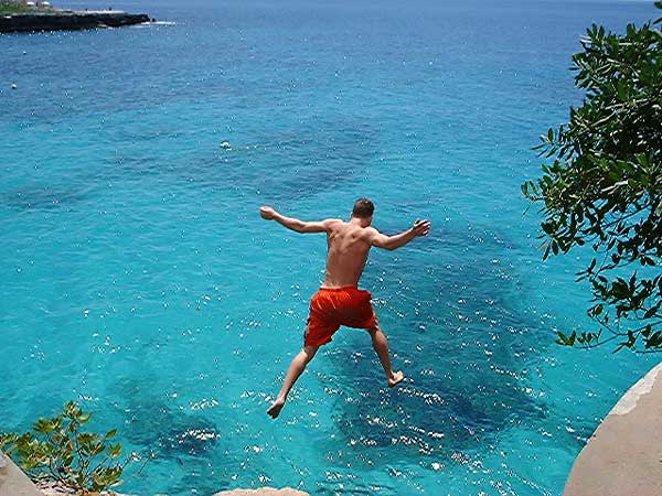 Brad Jumping from Pirate's Cave